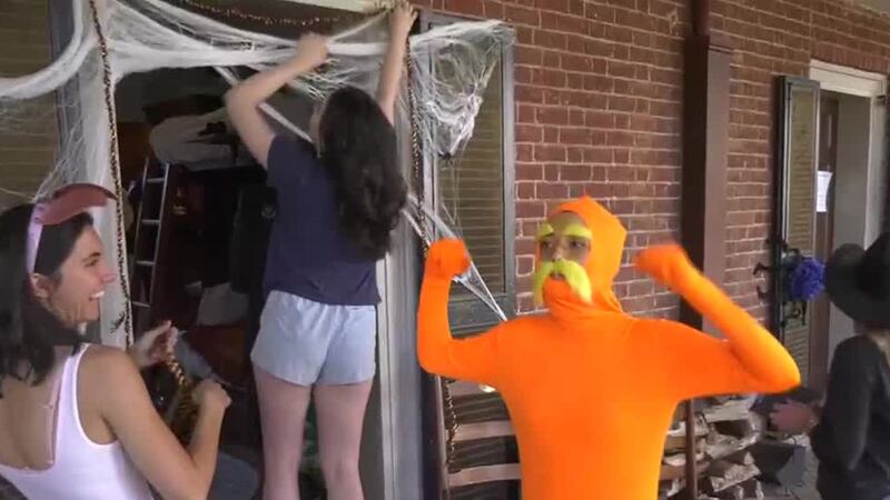 UVA students set up Halloween decorations on the Lawn on October 31, 2024.