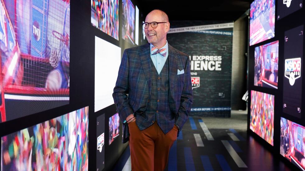 FILE -- Emmy award-winning host Ernie Johnson checks out the Amex Experience during the 2025...