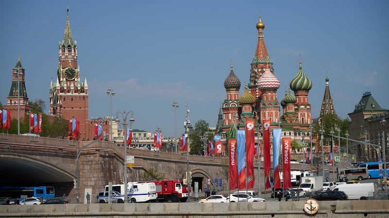 Special service vehicles are parked near Red Square decorated for the celebrations of the 81st...