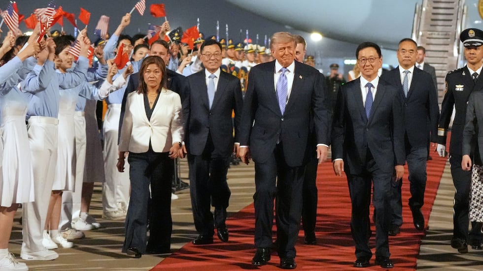 President Donald Trump walks with China's Vice President Han Zheng during a welcome ceremony...